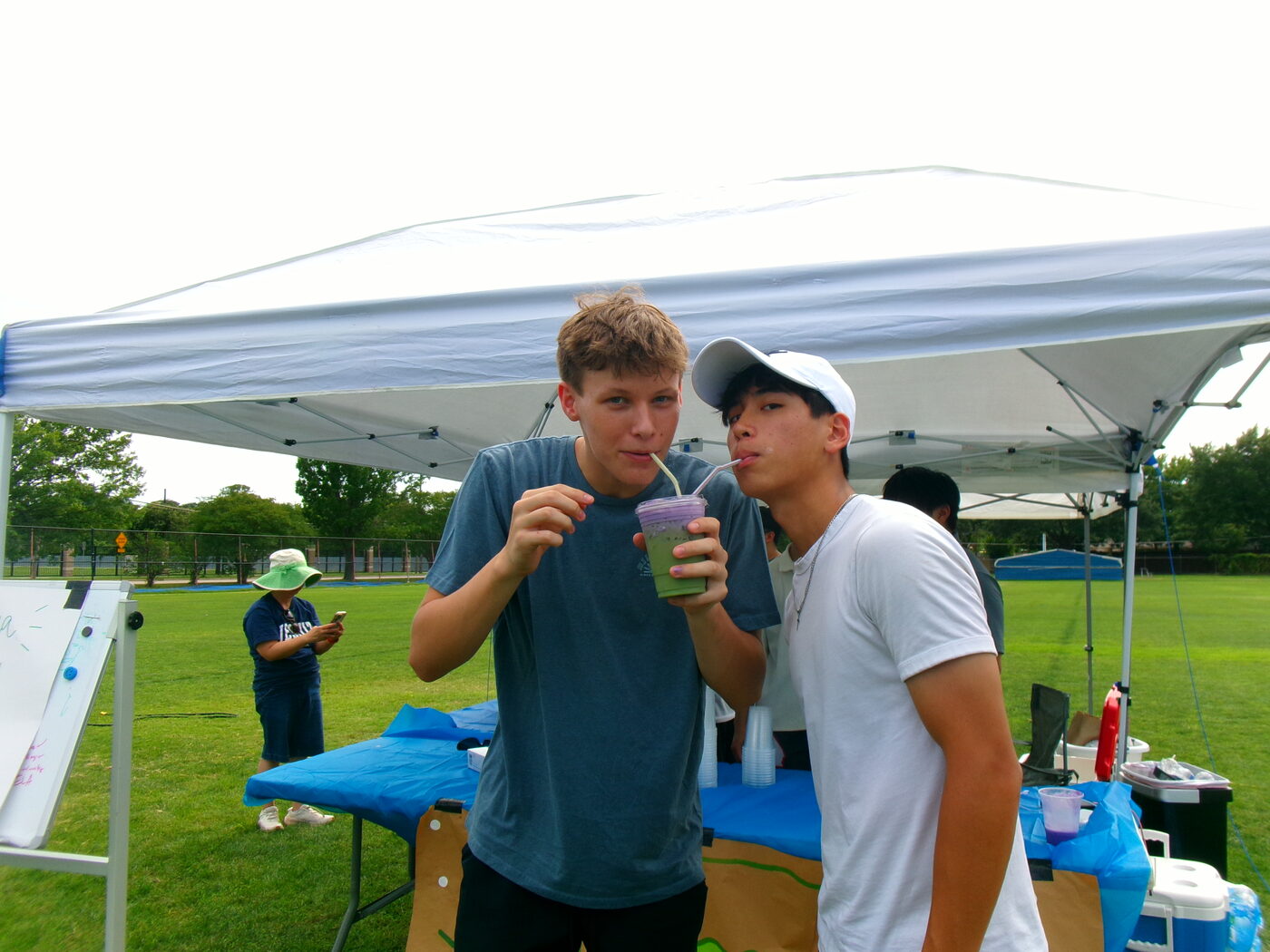 Two people sharing a drink at a 469 Matcha pop-up