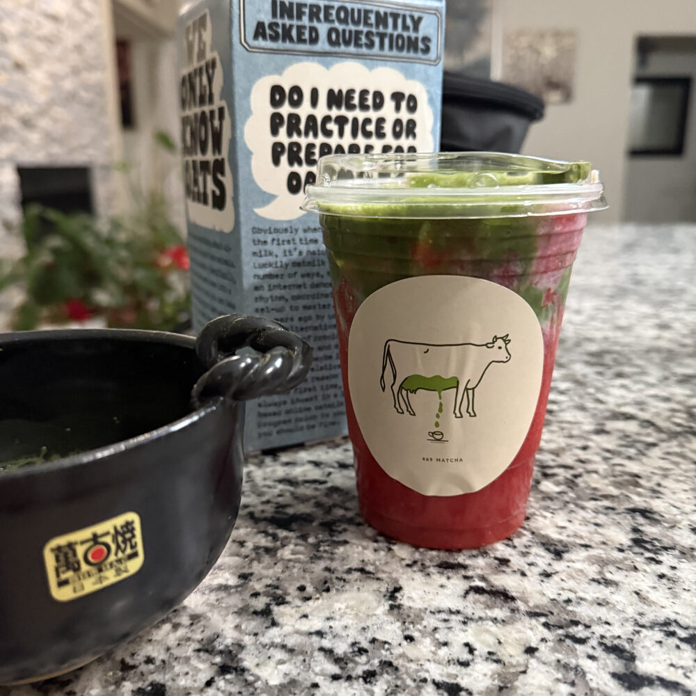Strawberry matcha beside a matcha bowl
