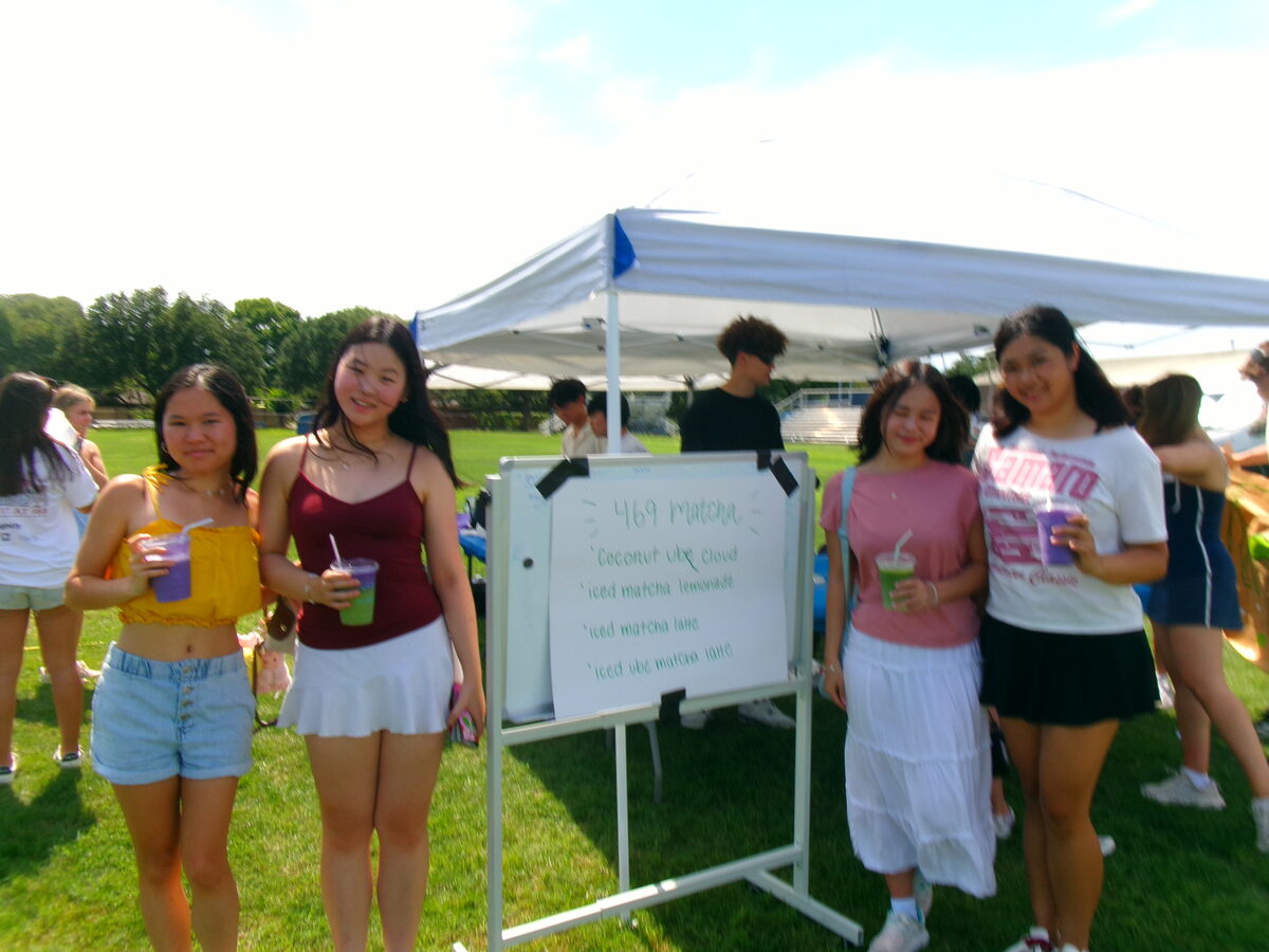 A group of customers holding matcha drinks