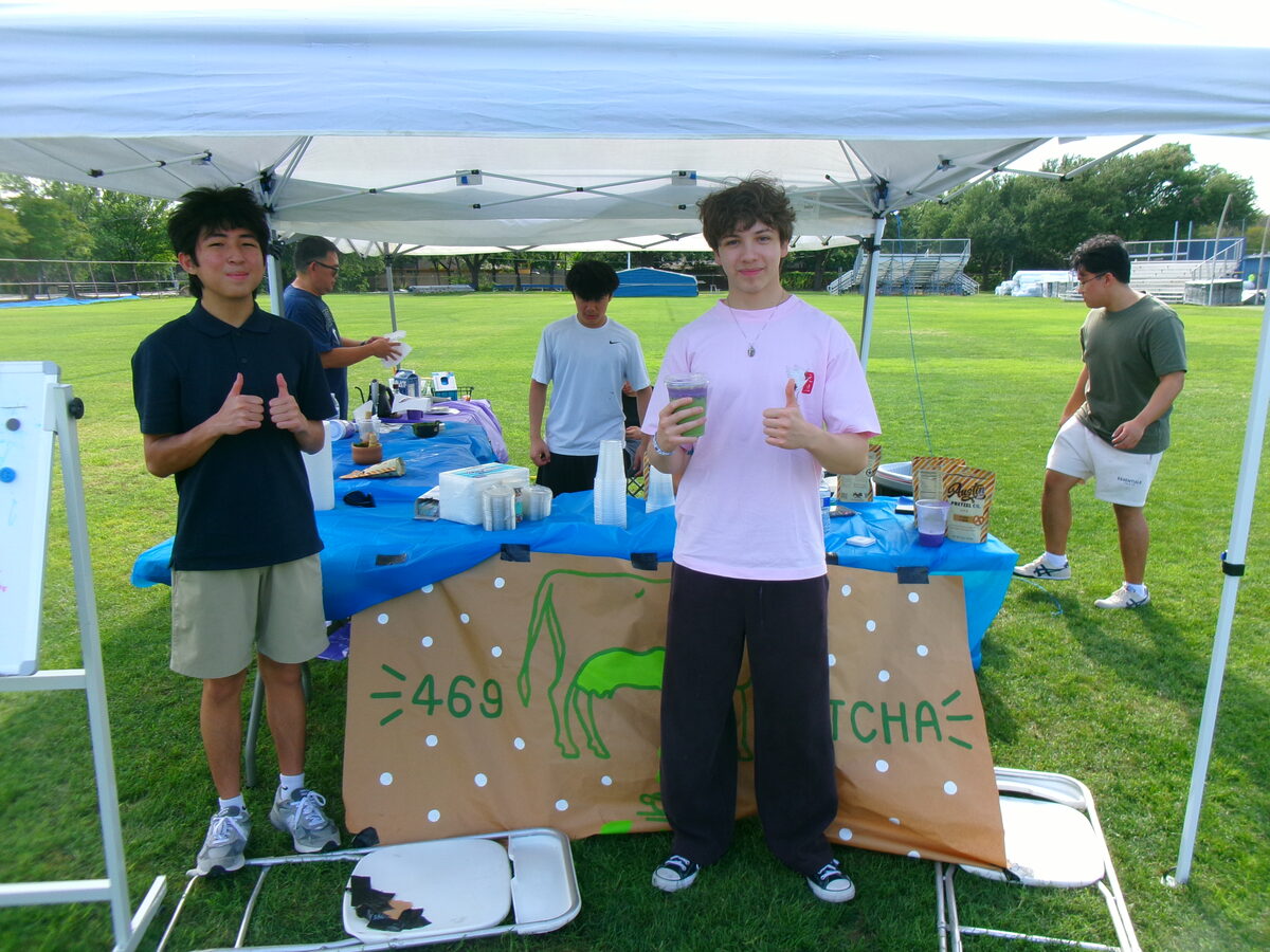 Two of the crew behind the table